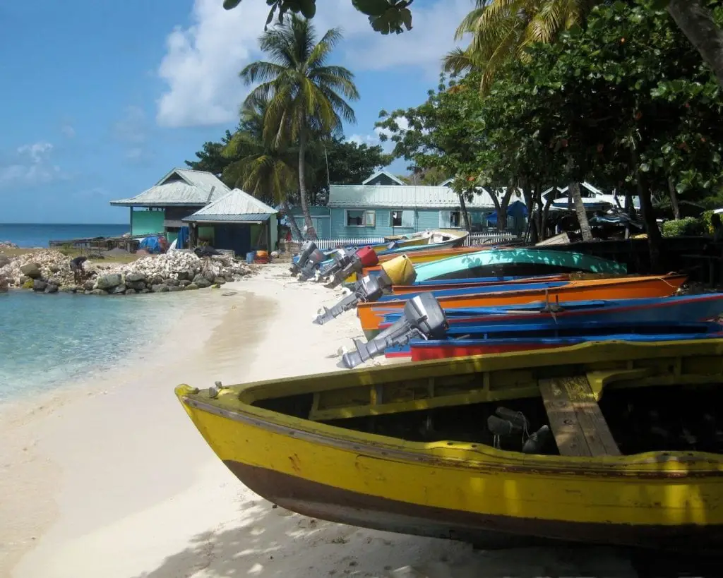 Colorful Fishing Boats on White Sand Beach in the Caribbean