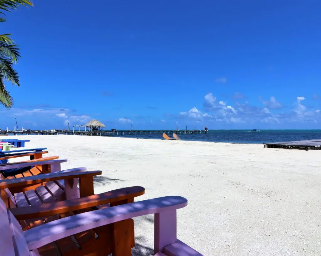 Beach in Caye Culker colored chairs