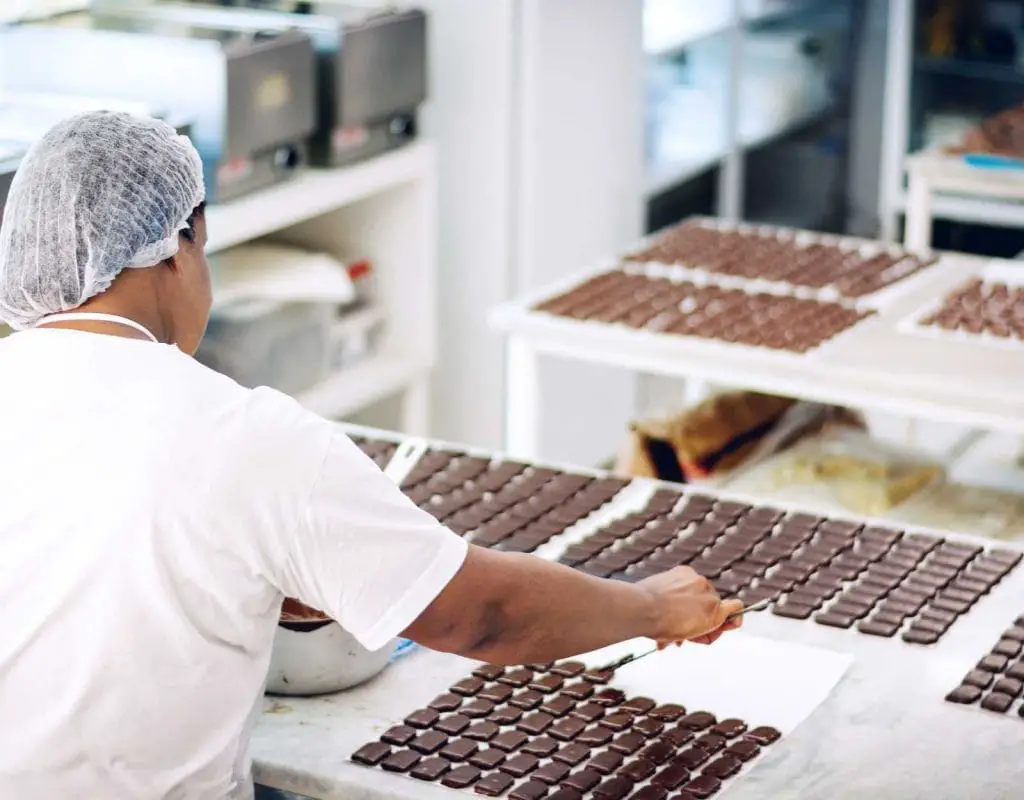 Woman preparing chocolate in a factory