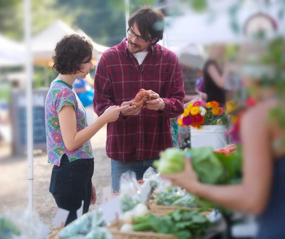 People talking at the farmers market